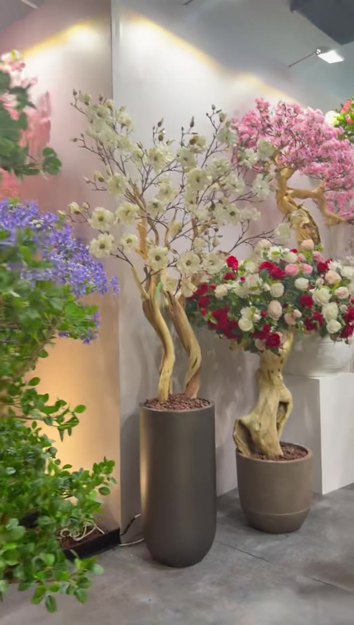 Curated display of artificial blossom and rose trees